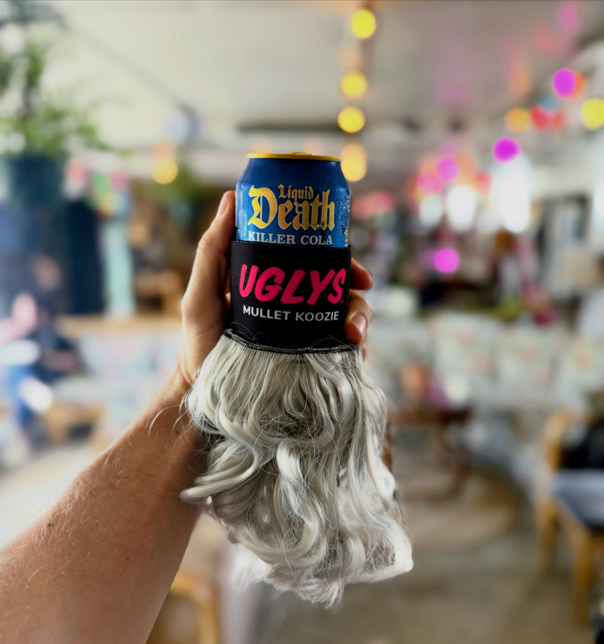UGLYS™️ Mullet Koozie from Uglys Eyewear, colorful foam beverage koozie with mullet hair design, fits standard cans and bottles.