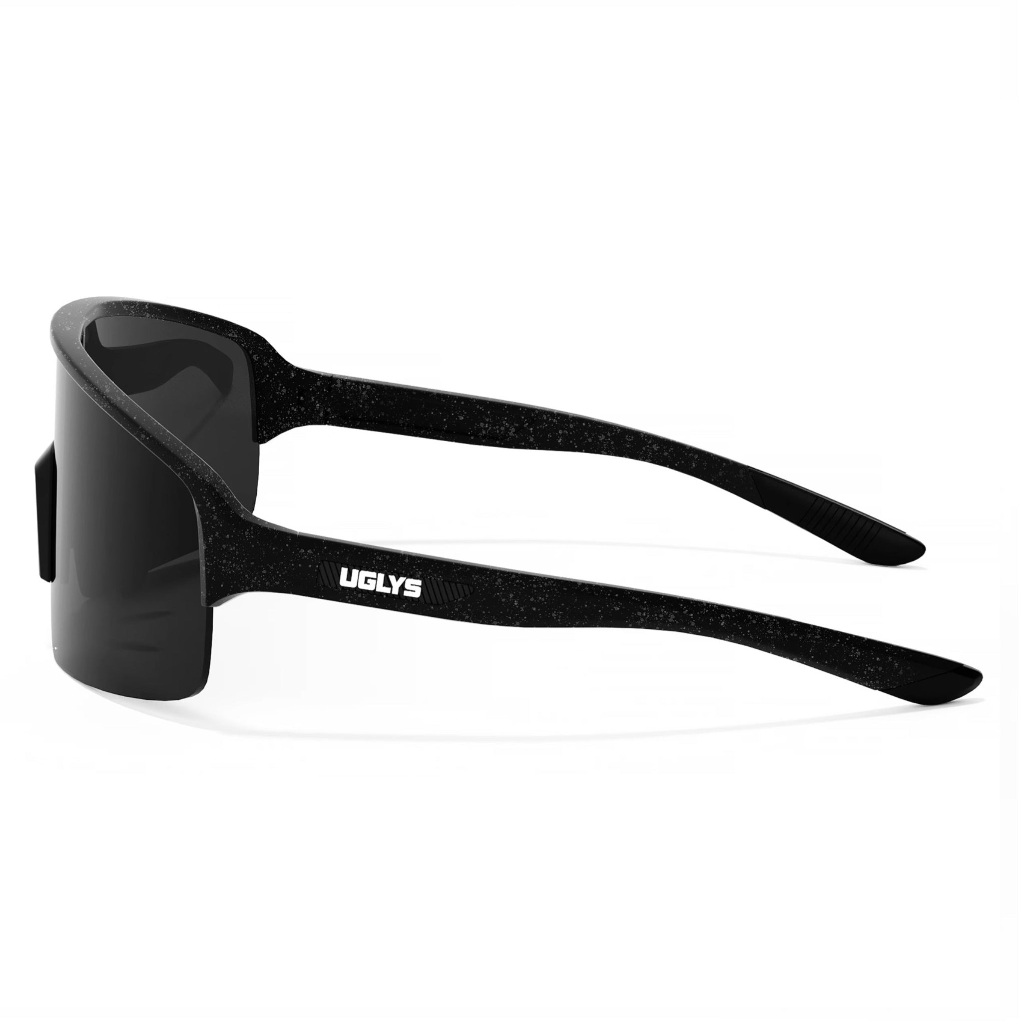 UGLYS™️ OG Blinders sunglasses with black frames and tinted lenses, worn by a person outdoors in a casual setting.