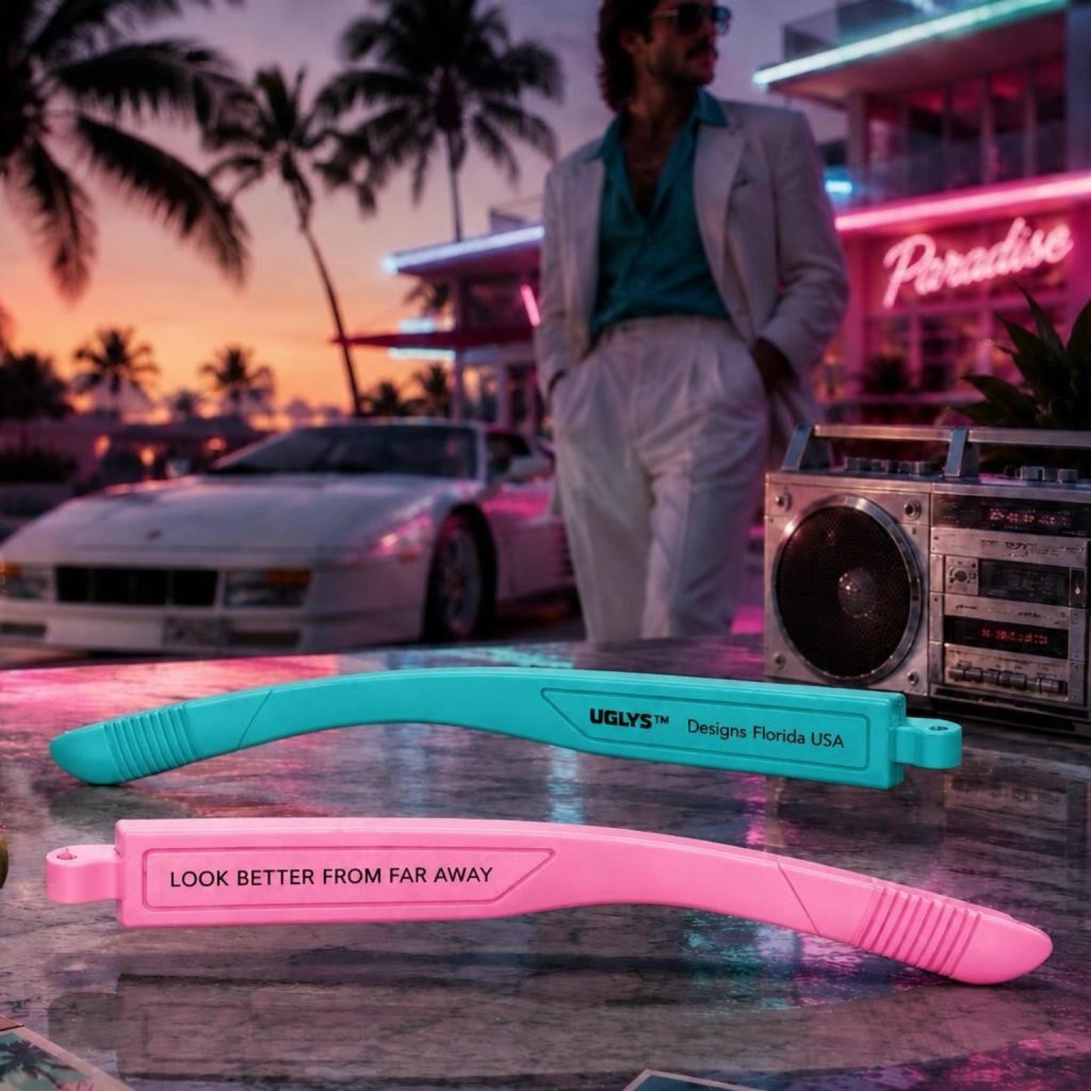 UGLYS™ Glow Job sunglasses with glow-in-the-dark lenses, stylish black frame, and UGLYS EYEWEAR branding.