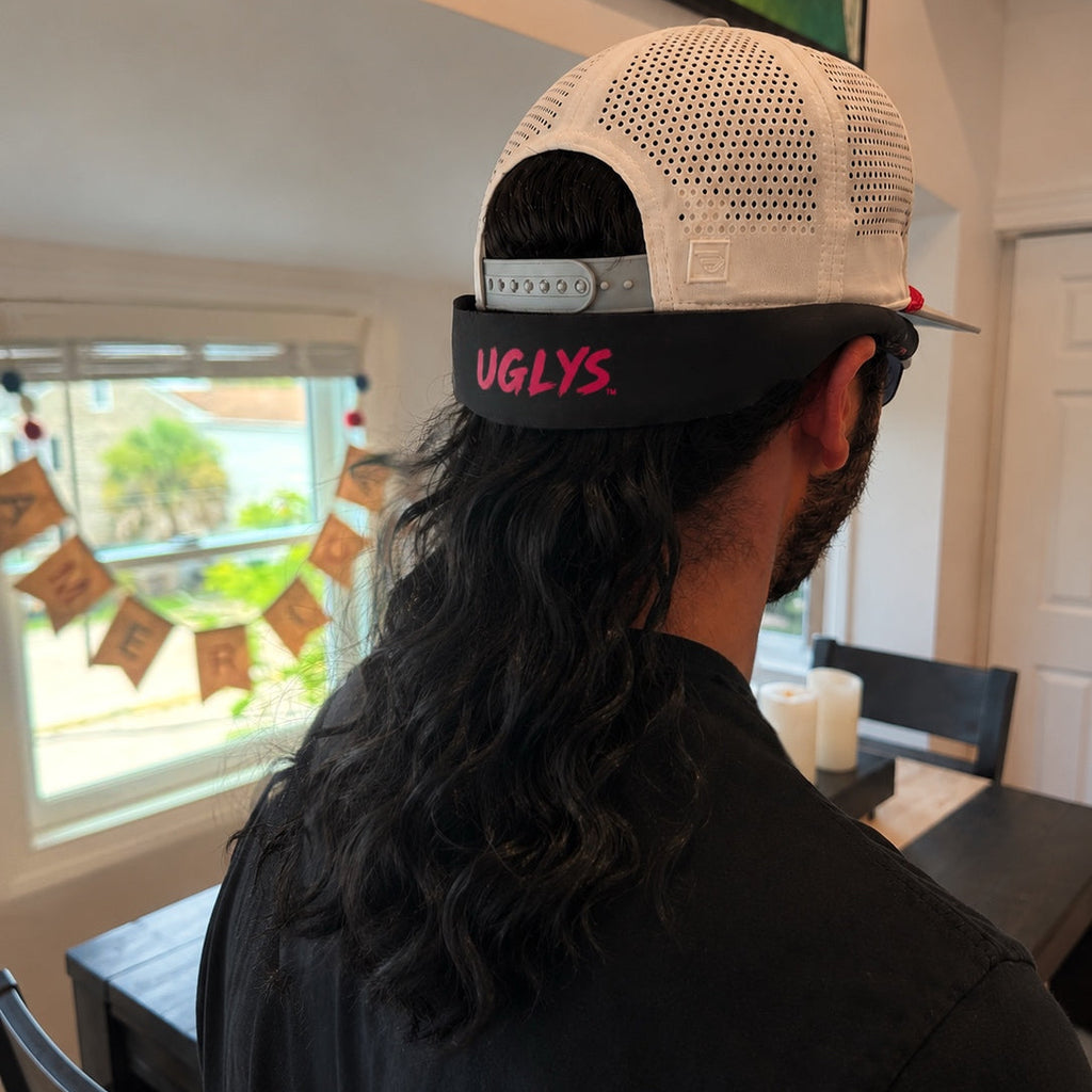UGLYS™️ Sunglass Strapped Mullet with colorful, layered hair design and attached sunglasses, showcasing a playful fashion accessory.