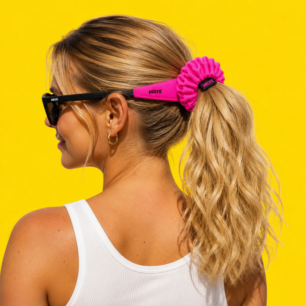 Uglys Eyewear UGLYS™ Sunglass Strap-On Pony in bright pink with adjustable strap and playful design for fun, secure sunglasses wear